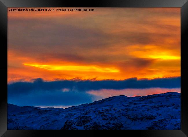  A Dramatic Sunset Over Norway Framed Print by Judith Lightfoot