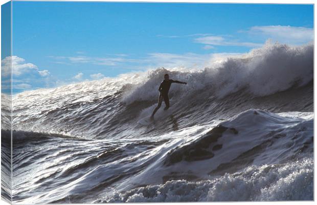 Surfing at Langland Bay.  Canvas Print by Tony Dimech