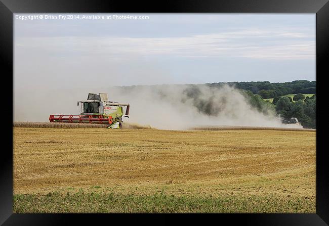  Combines at work Framed Print by Brian Fry