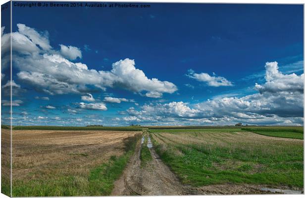 drifting clouds Canvas Print by Jo Beerens