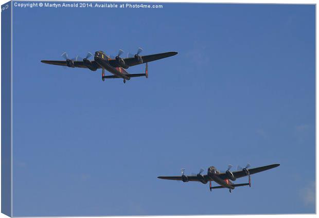  Lancaster Flypast - East Kirkby Canvas Print by Martyn Arnold