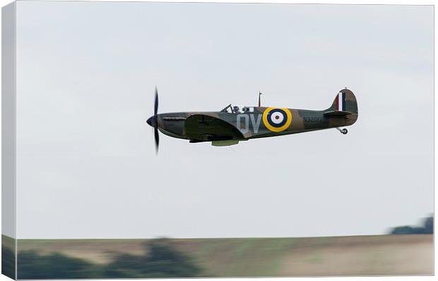 Spitfire low-level flying Canvas Print by Gary Eason