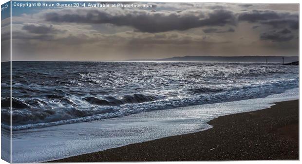  Dark Clouds over the Sea at West Bay in Dorset Canvas Print by Brian Garner