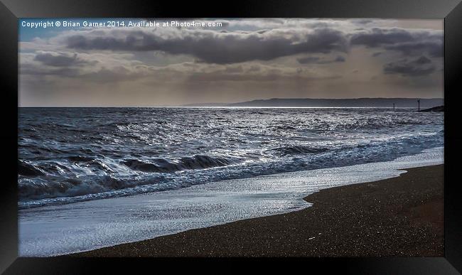  Dark Clouds over the Sea at West Bay in Dorset Framed Print by Brian Garner