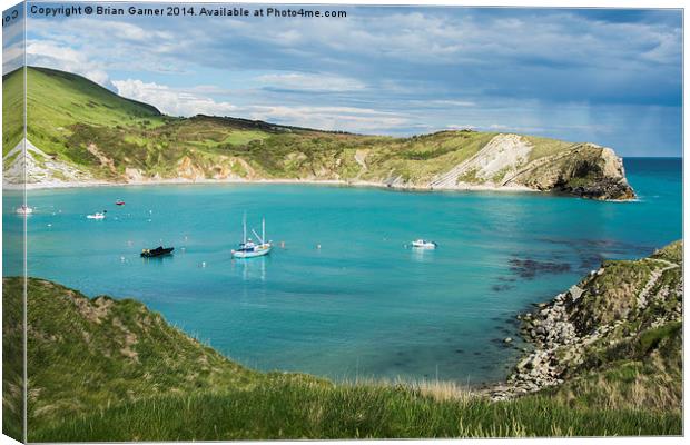 Bright Sky over Lulworth Cove with rain out to sea Canvas Print by Brian Garner