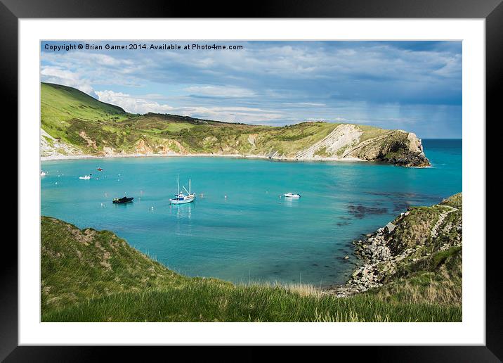 Bright Sky over Lulworth Cove with rain out to sea Framed Mounted Print by Brian Garner