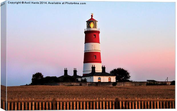 Happisburgh lighthouse shining Canvas Print by Avril Harris