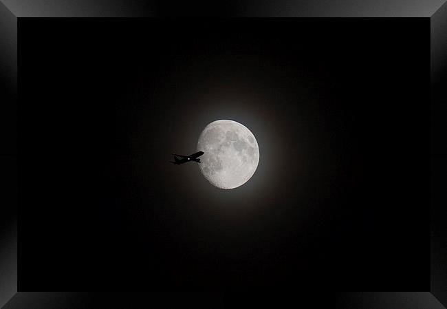 Airliner passing in front of the Moon Framed Print by Gary Eason
