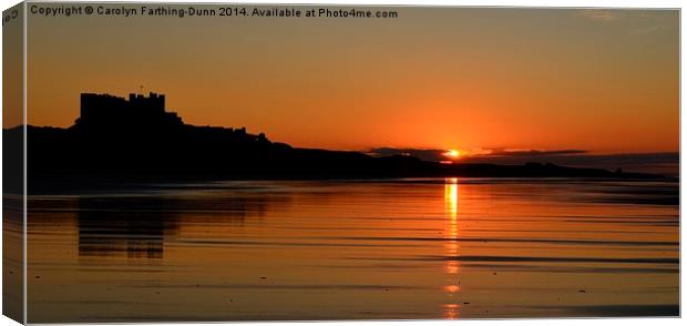  Bamburgh Castle at Sunset Canvas Print by Carolyn Farthing-Dunn
