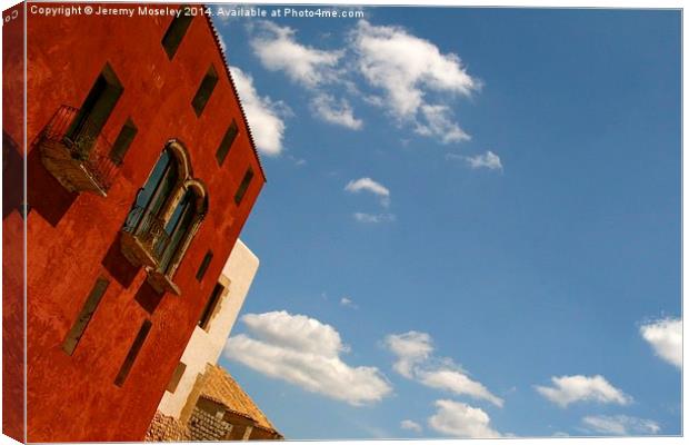 Colourful architecture and wonderful skies, Ibiza. Canvas Print by Jeremy Moseley