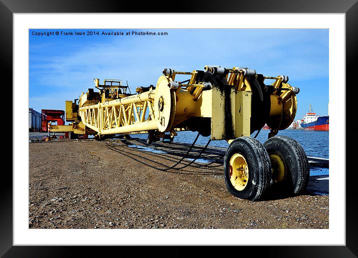  A bright yellow crane jib lying the ground Framed Mounted Print by Frank Irwin