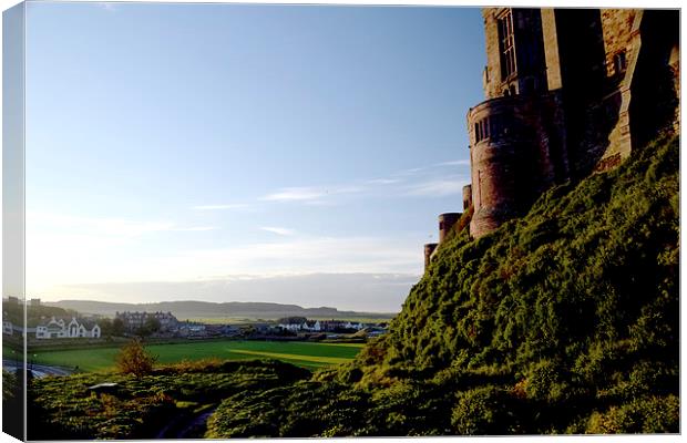  Stunning view from behind Bamburgh Castle Canvas Print by Michael Maher