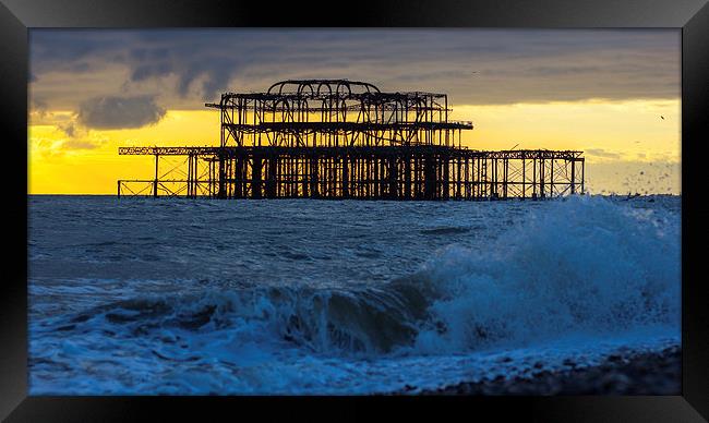Brighton West Pier at sunset Framed Print by Dean Messenger
