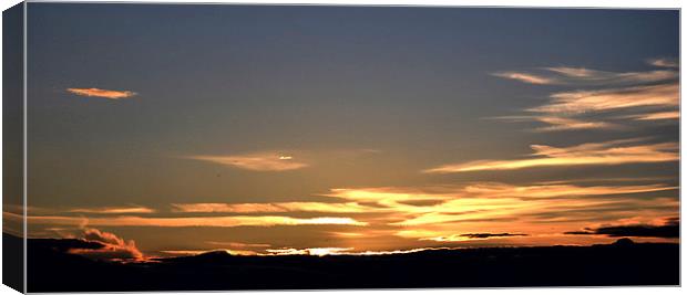  a sunset at Bamburgh Canvas Print by Michael Maher