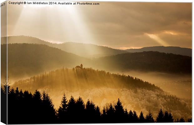Afternoon rays over church Canvas Print by Ian Middleton
