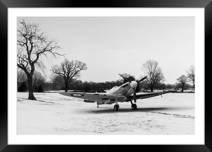 Spitfire in the snow black and white version Framed Mounted Print by Gary Eason
