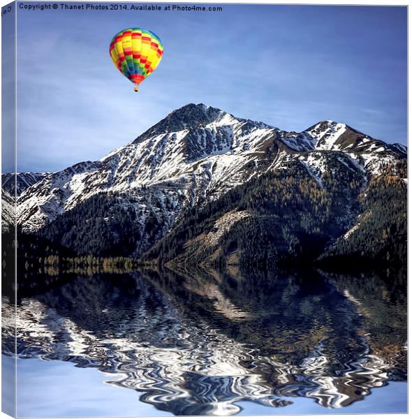 Hot air ballon over the Alps Canvas Print by Thanet Photos