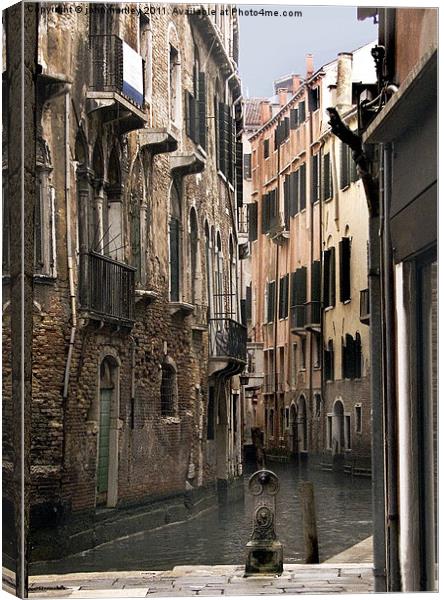 Inside Venice - Tall buildings dwarf a Venetian Ca Canvas Print by john hartley