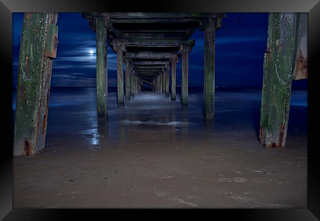  Under the pier at night Framed Print by Paul Nichols