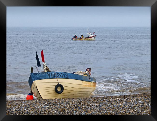 "Coming Ashore" Fishing Boat Landing on the beach  Framed Print by john hartley