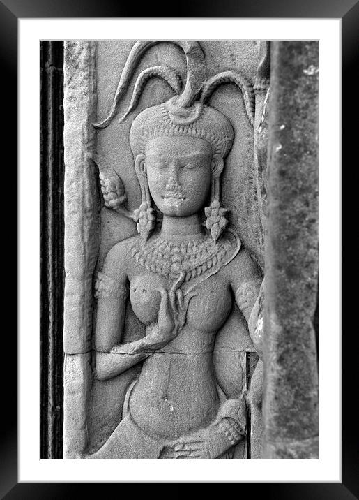 Carving in temple wall at Angkor Wat Framed Mounted Print by Dave Carroll
