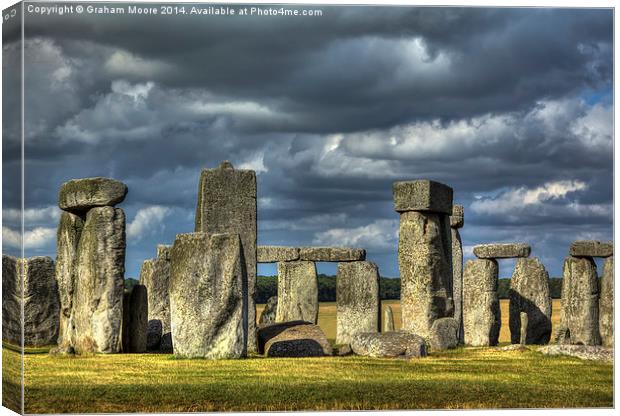 Stonehenge in gathering storm Canvas Print by Graham Moore