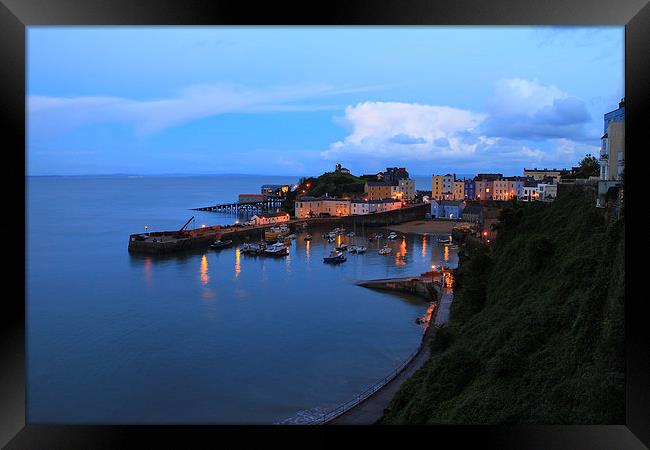 Sunset Tenby Harbour with lights Framed Print by Jonathan Evans