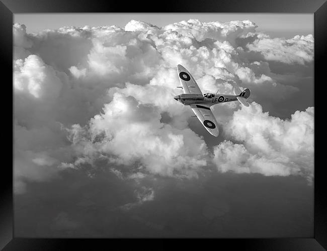 Soaring silver Spitfire cloudscape black and white Framed Print by Gary Eason