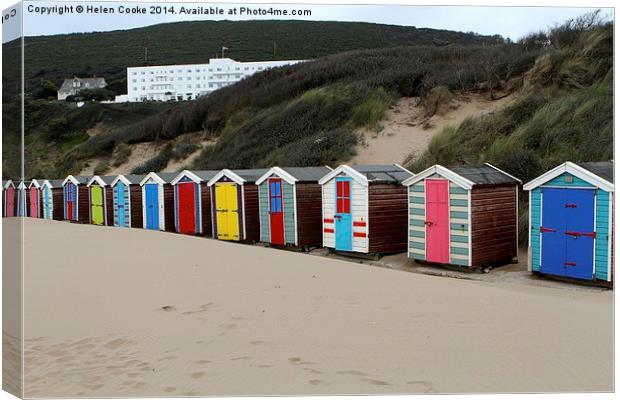  Bright beach huts at Saunton Canvas Print by Helen Cooke