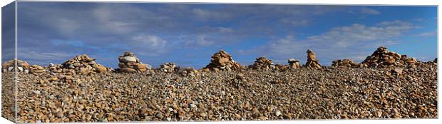 Cobble Cairns on Holy Isle  Canvas Print by Donald Parsons