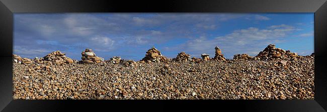 Cobble Cairns on Holy Isle  Framed Print by Donald Parsons