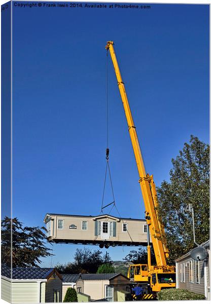 A caravan on the end of a crane hook Canvas Print by Frank Irwin