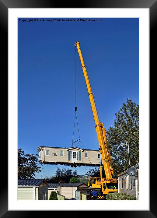 A caravan on the end of a crane hook Framed Mounted Print by Frank Irwin
