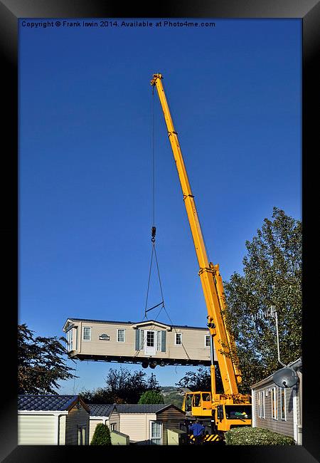 A caravan on the end of a crane hook Framed Print by Frank Irwin
