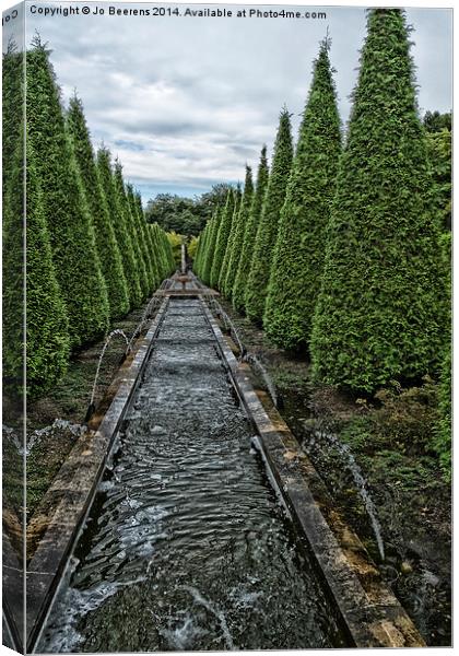conifer lined water feature Canvas Print by Jo Beerens