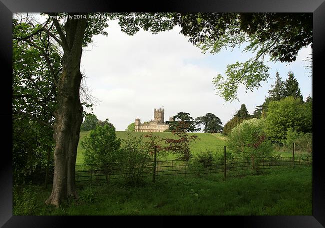 The famous Downton Abbey on top of the hill Framed Print by James Tully