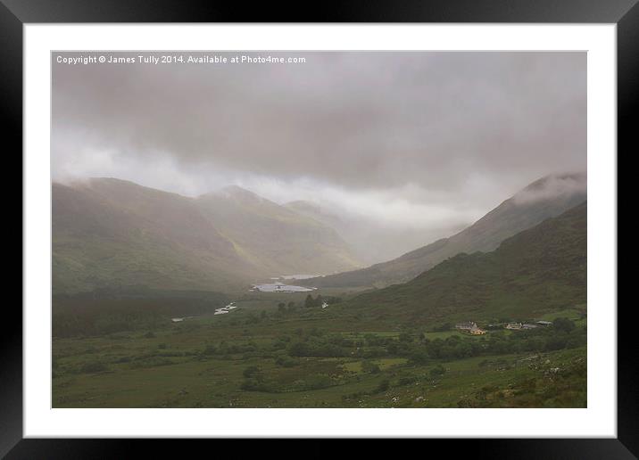  Heavy clouds sit within an Irish valley Framed Mounted Print by James Tully