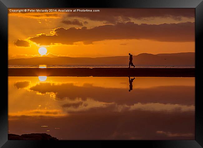  Walking into the Sunset  Framed Print by Peter Mclardy