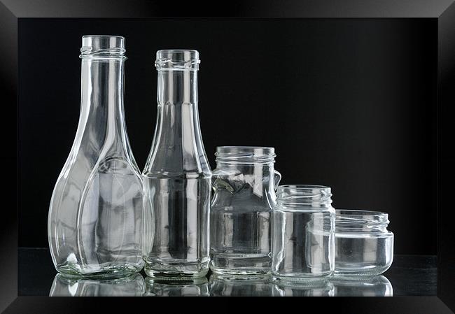 Glass bottles on black background Framed Print by Josep M Peñalver