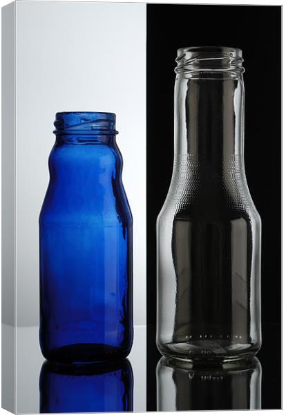 Glass bottles. Transparent over black, blue over w Canvas Print by Josep M Peñalver