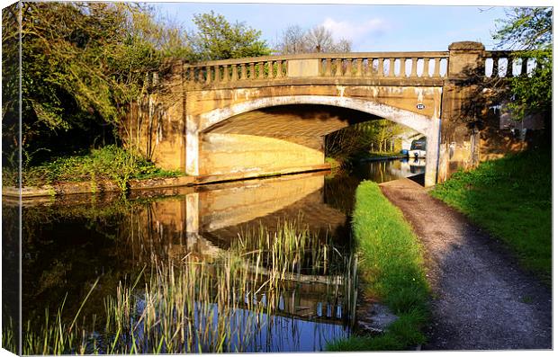  Reflections under the bridge Lancaster Canal Canvas Print by Gary Kenyon