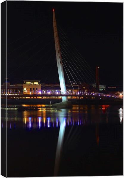  bridge lit up at night at swansea marina, south w Canvas Print by craig preece