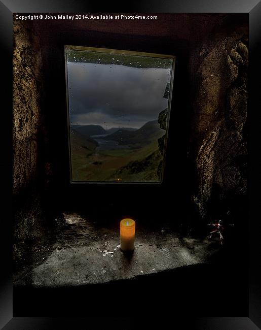  Light a candle in the window Framed Print by John Malley