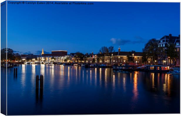  River Amstel, Amsterdam at Night Canvas Print by Carolyn Eaton