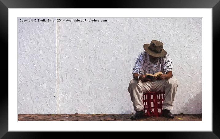  Man reading sitting on a crate Framed Mounted Print by Sheila Smart