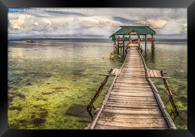 Rickety Pier Mactan Island Philippines Framed Print by Adrian Evans