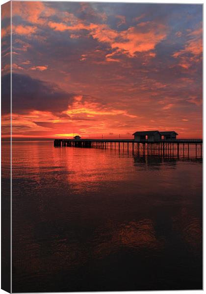 Penarth Pier and sun rise over the bristol Channel Canvas Print by Jonathan Evans