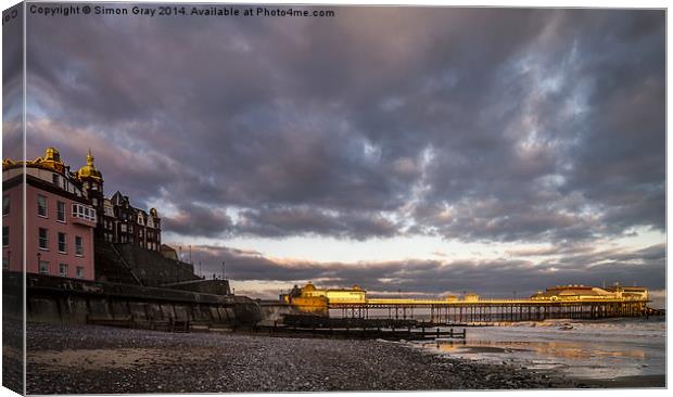  Lighting Up the Pier Canvas Print by Simon Gray