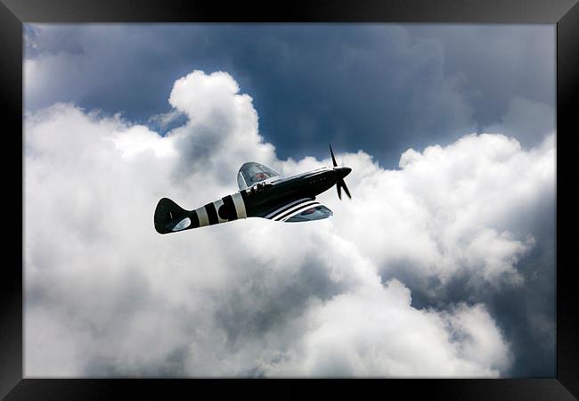 Spitfire Cloudy Skies  Framed Print by J Biggadike
