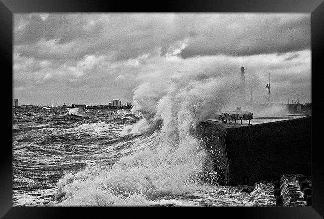 Waves crashing over sea wall Framed Print by Sharpimage NET